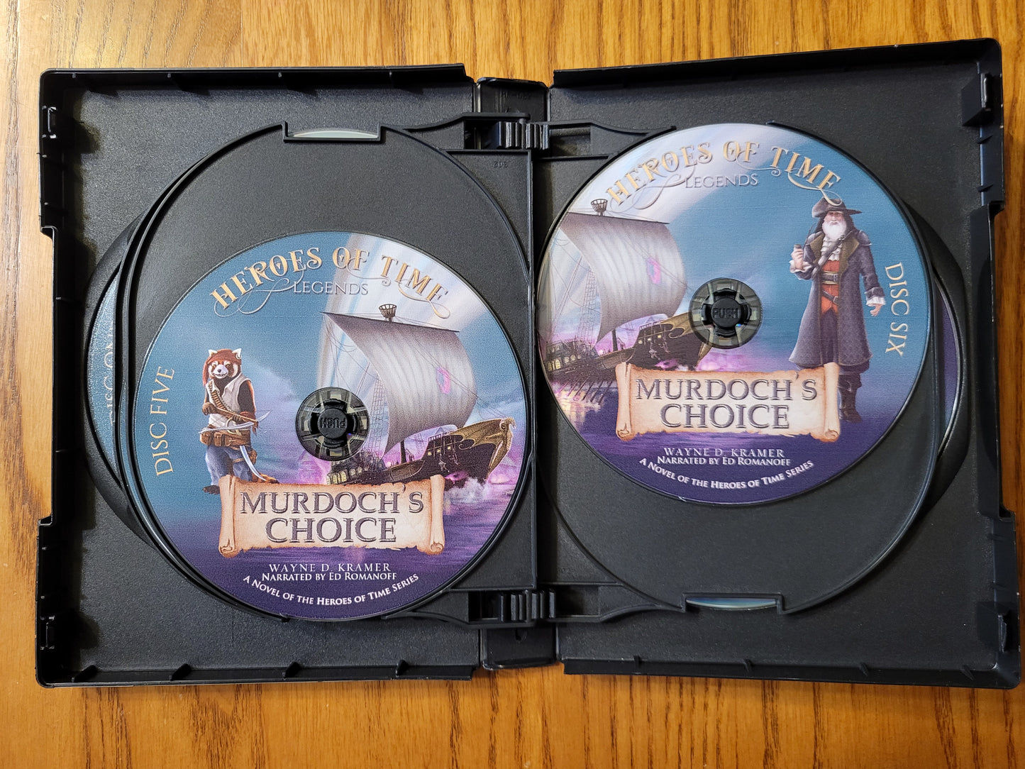 Murdoch's Choice Audiobook CD Discs 5 and 6, featuring Boomer and Seadread art